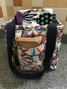 Small Utility Tote featured holding a beach towel and wallet