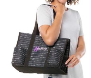 Mom carrying a black and silver Zip-Top Organizing Utility Tote with the hashtag #momlife on the bag