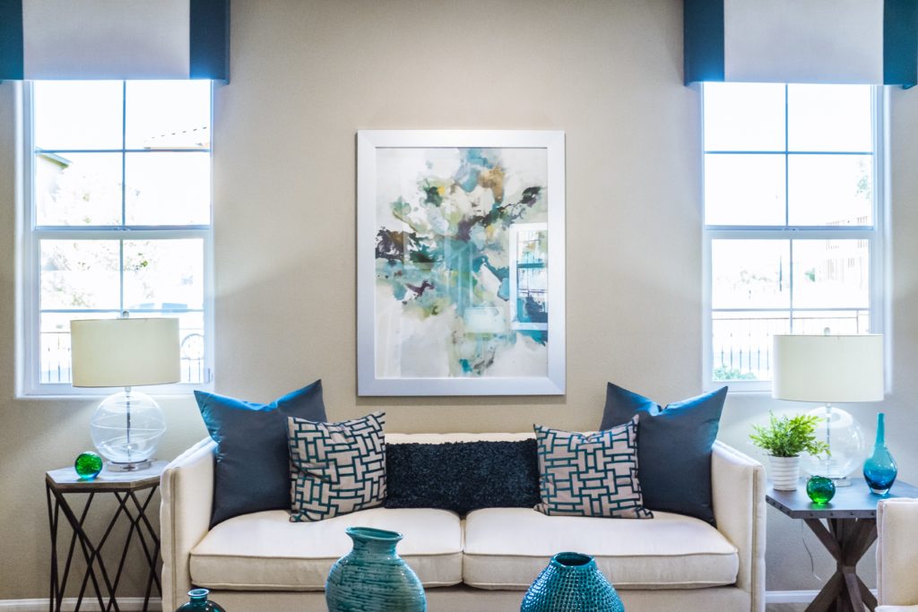 Tidy living room with colorful teal accents