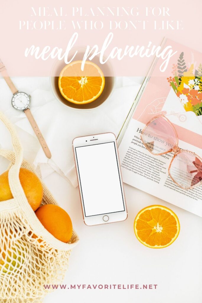 Flatlay with cellphone, oranges, book and sunglasses - rose