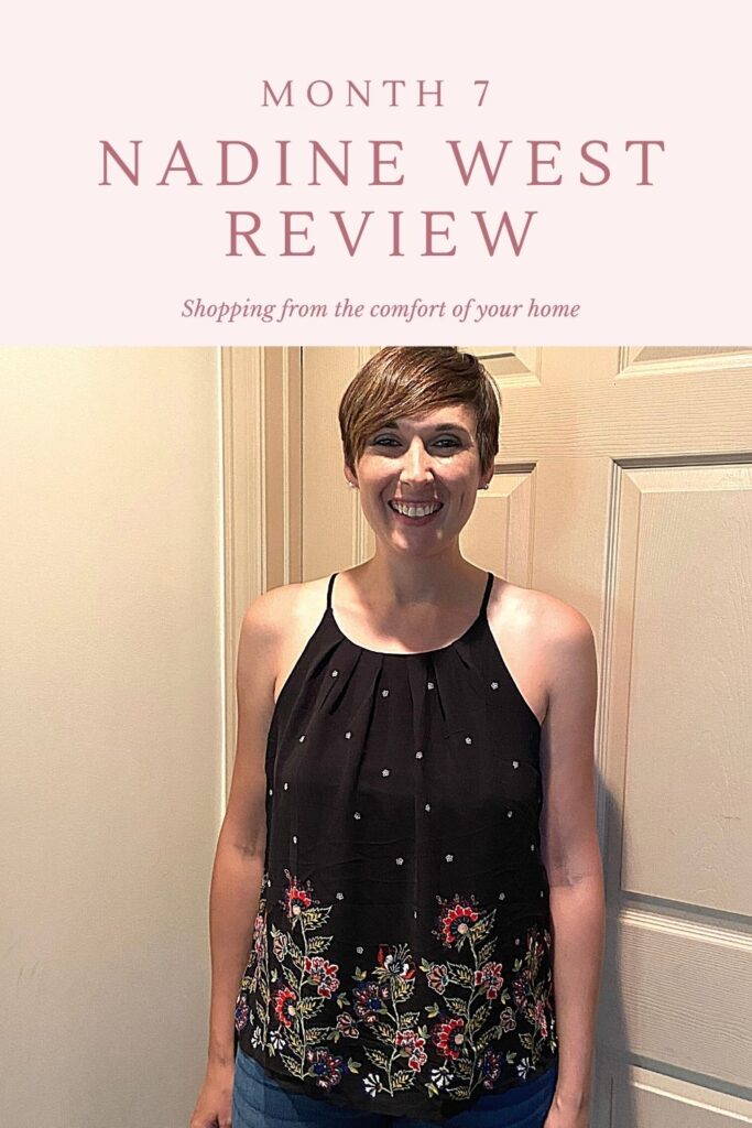 Woman wearing black spaghetti strap chiffon shirt with floral detail on bottom