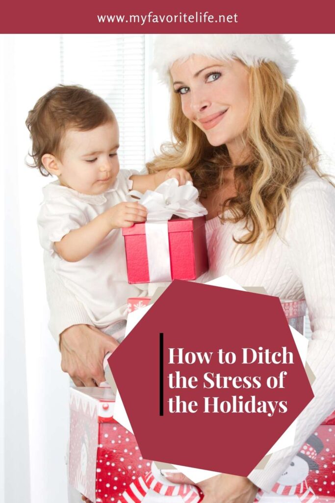 How to Ditch the Stress - Mom in Santa had hold baby and gifts